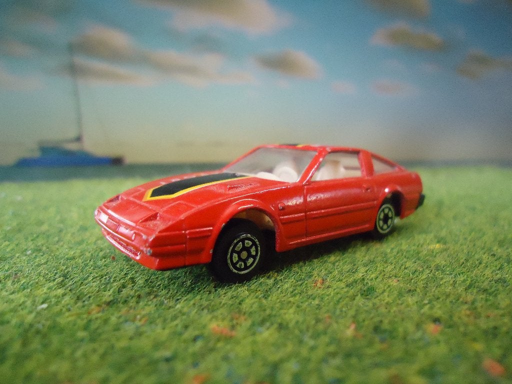 1:64 Nissan 300 Z / ZX - YatMing rood, Hobby en Vrije tijd, Ophalen of Verzenden, Gebruikt, Auto