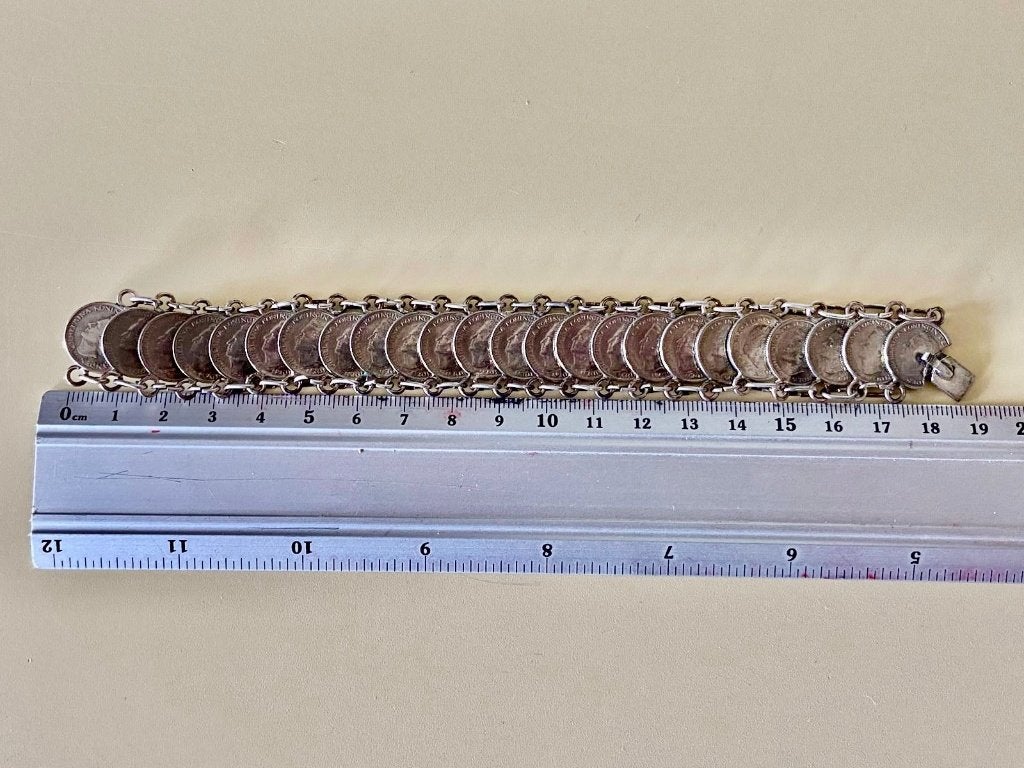 Zilverkleurige dubbeltjes armband, Ophalen of Verzenden, Gebruikt, Zilver, Overige materialen