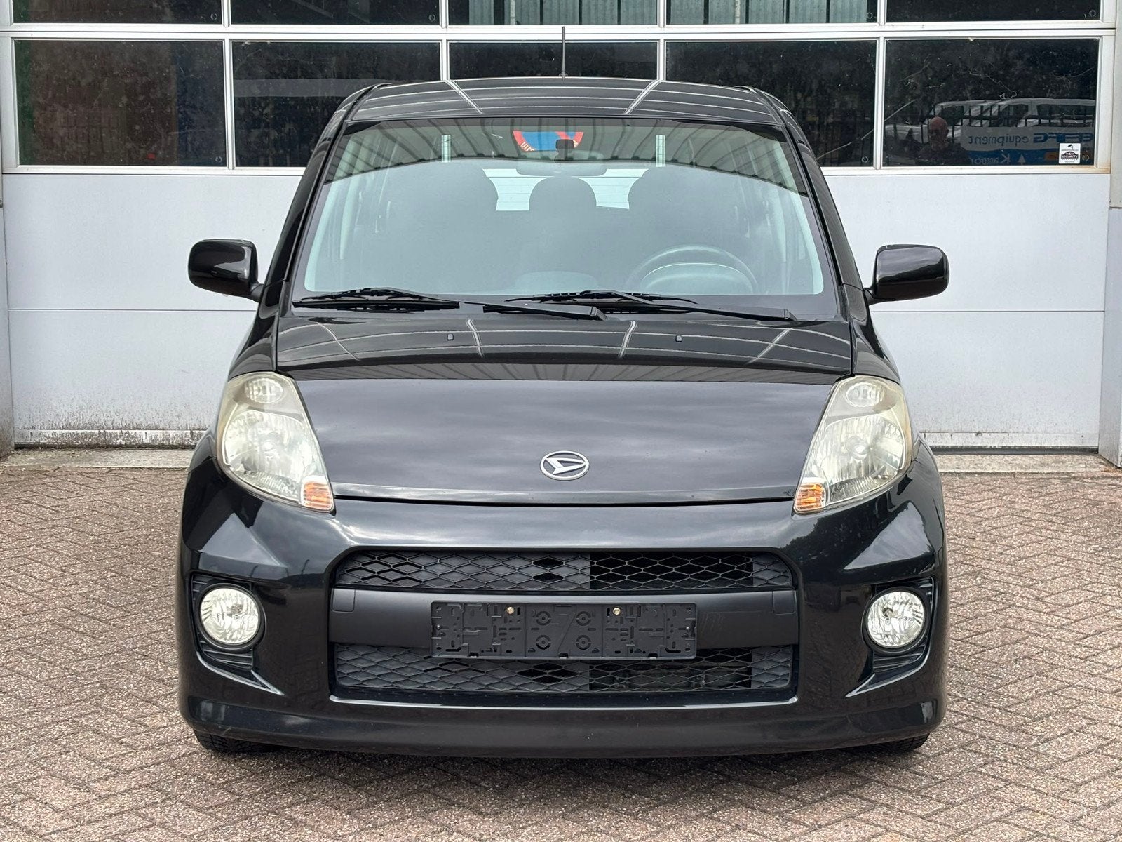 Daihatsu Sirion 1.3 2007 Zwart SPORT, Auto's, Voorwielaandrijving, Stof, 4 cilinders, Zwart