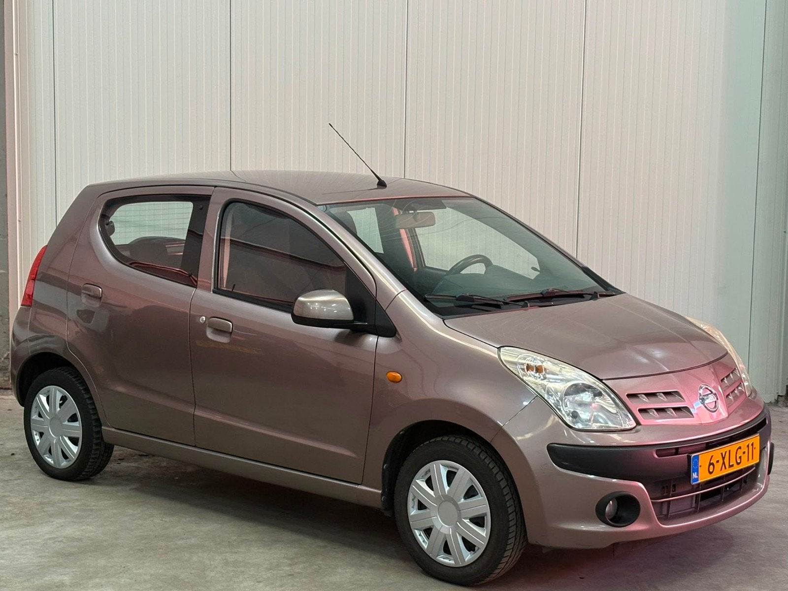 Nissan Pixo 1.0 50KW 5D 2010 Bruin, Auto's, Voorwielaandrijving, Stof, Bruin, 4 stoelen