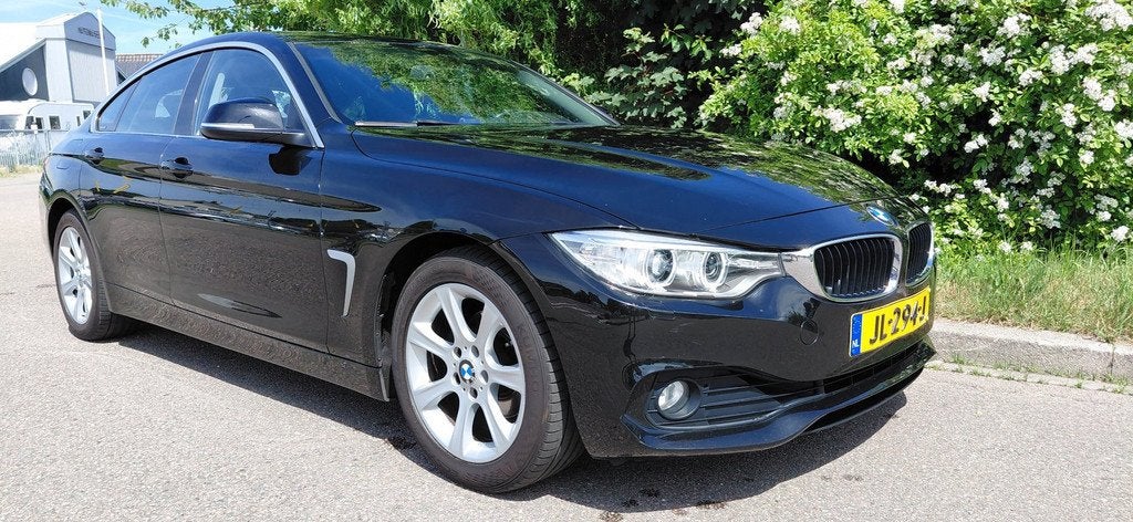 BMW 4-serie Gran Coupé 418i Centennial Executive in Schitte, Auto's, BMW, Automaat, Gebruikt, Met garantie (alle), Zwart