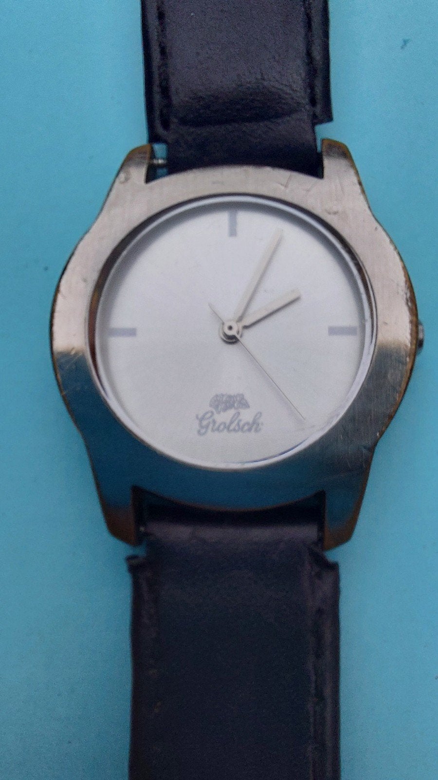 Grolsch horloge. By Olympic., Ophalen of Verzenden, Gebruikt, Leer, Overige merken
