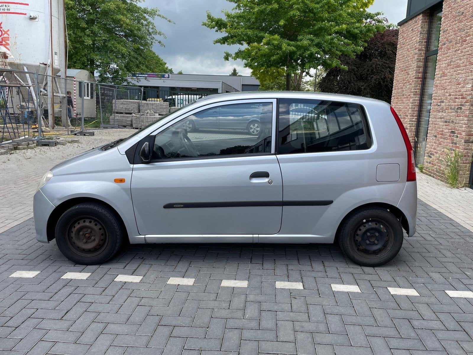 Daihatsu Cuore 1.0-12V Azure, Auto's, Daihatsu, ABS, 18 €/maand, 4 stoelen, Cuore