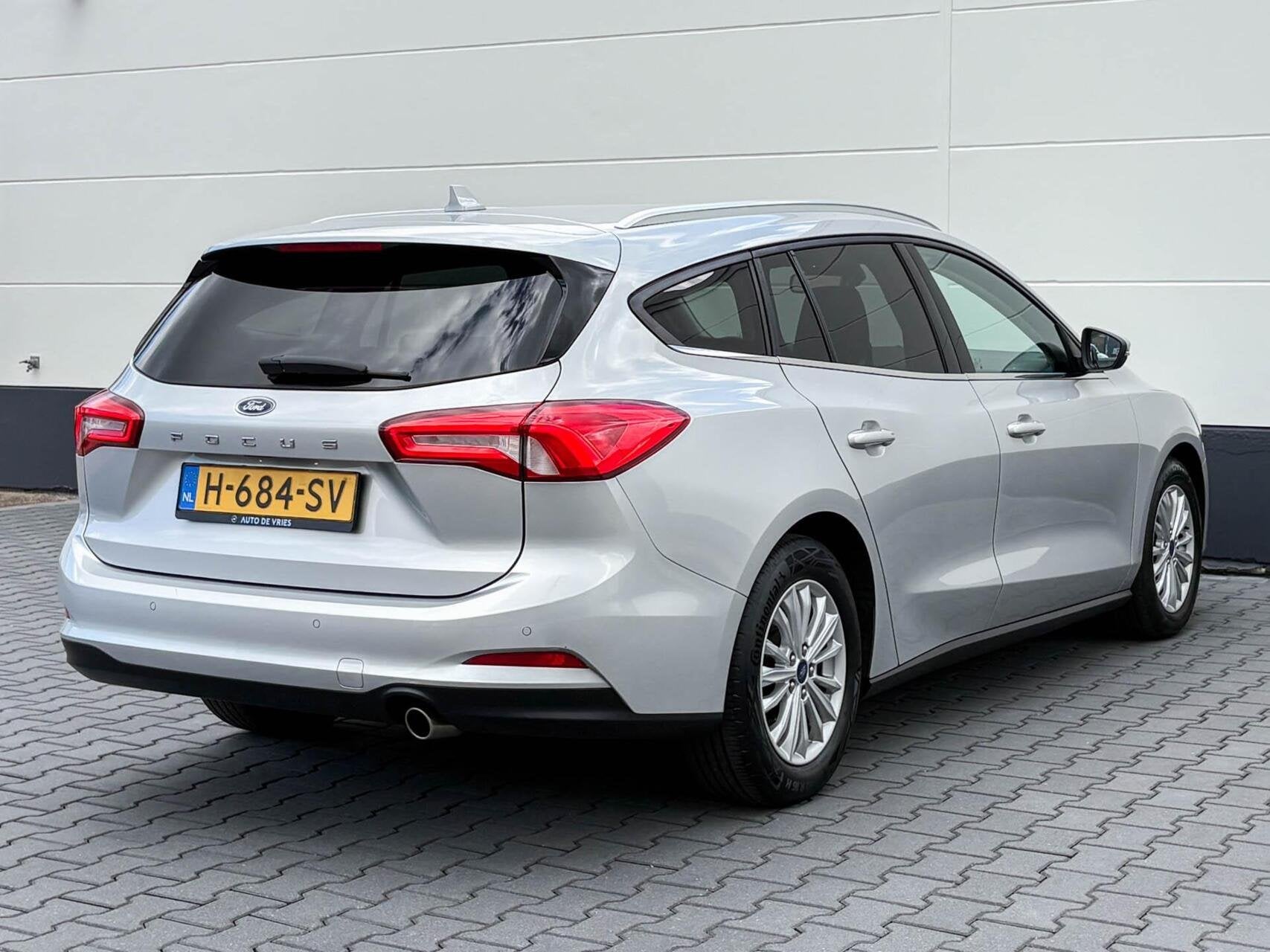 Ford Focus Wagon 1.0 125pk EcoBoost Automaat Titanium Busine, Gebruikt, Origineel Nederlands, 3 cilinders, Zilver of Grijs