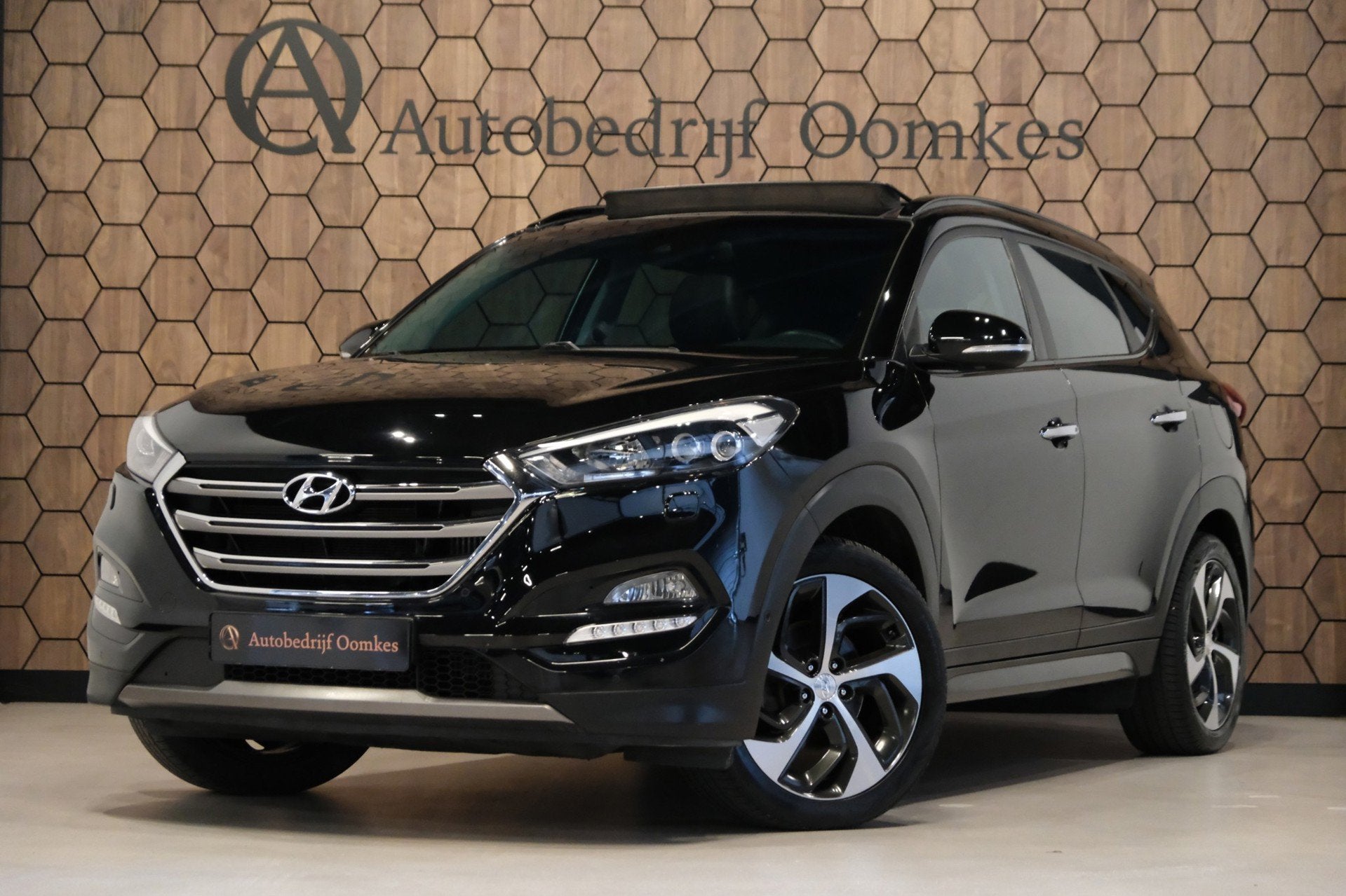 Hyundai Tucson 1.6 T-GDi 4WD *PANORAMADAK* Leder/Afn. Trekha, Auto's, Gebruikt, 4 cilinders, Lichtsensor, Zwart