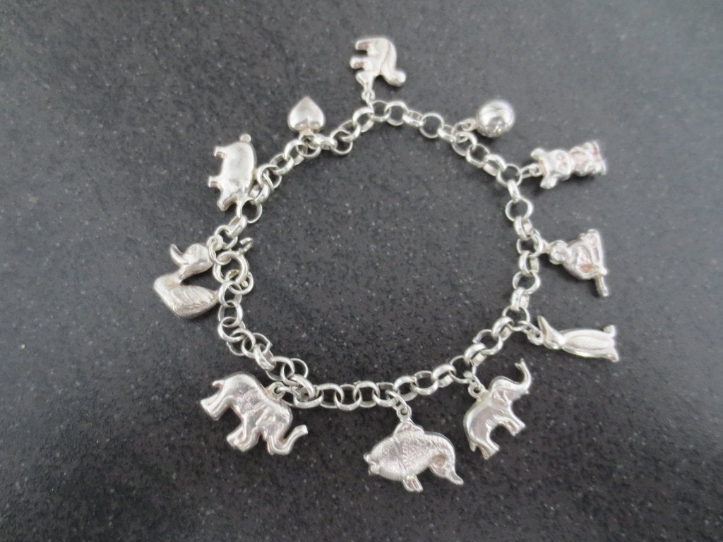 Zilveren Sieraad : Bedelarmband met 11 zilveren bedels izgs., Sieraden, Tassen en Uiterlijk, Antieke sieraden, Ophalen of Verzenden