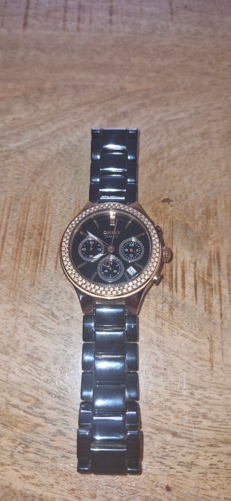 DKNY Dameshorloge met strass en zwarte band, Ophalen of Verzenden, Gebruikt
