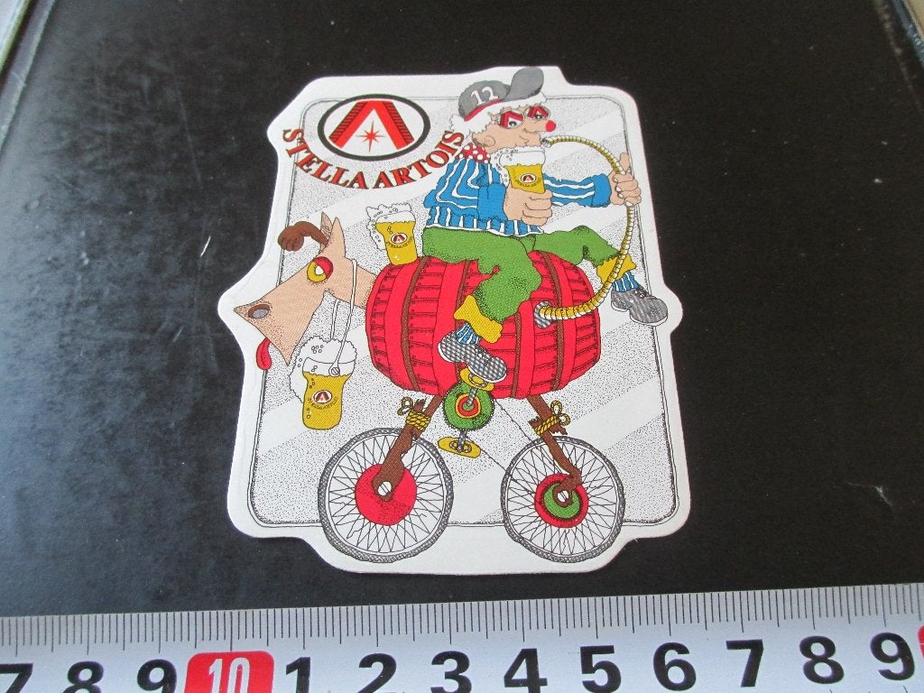 sticker 037 STELLA ARTOIS bier pils strip fiets hond, Ophalen, Zo goed als nieuw
