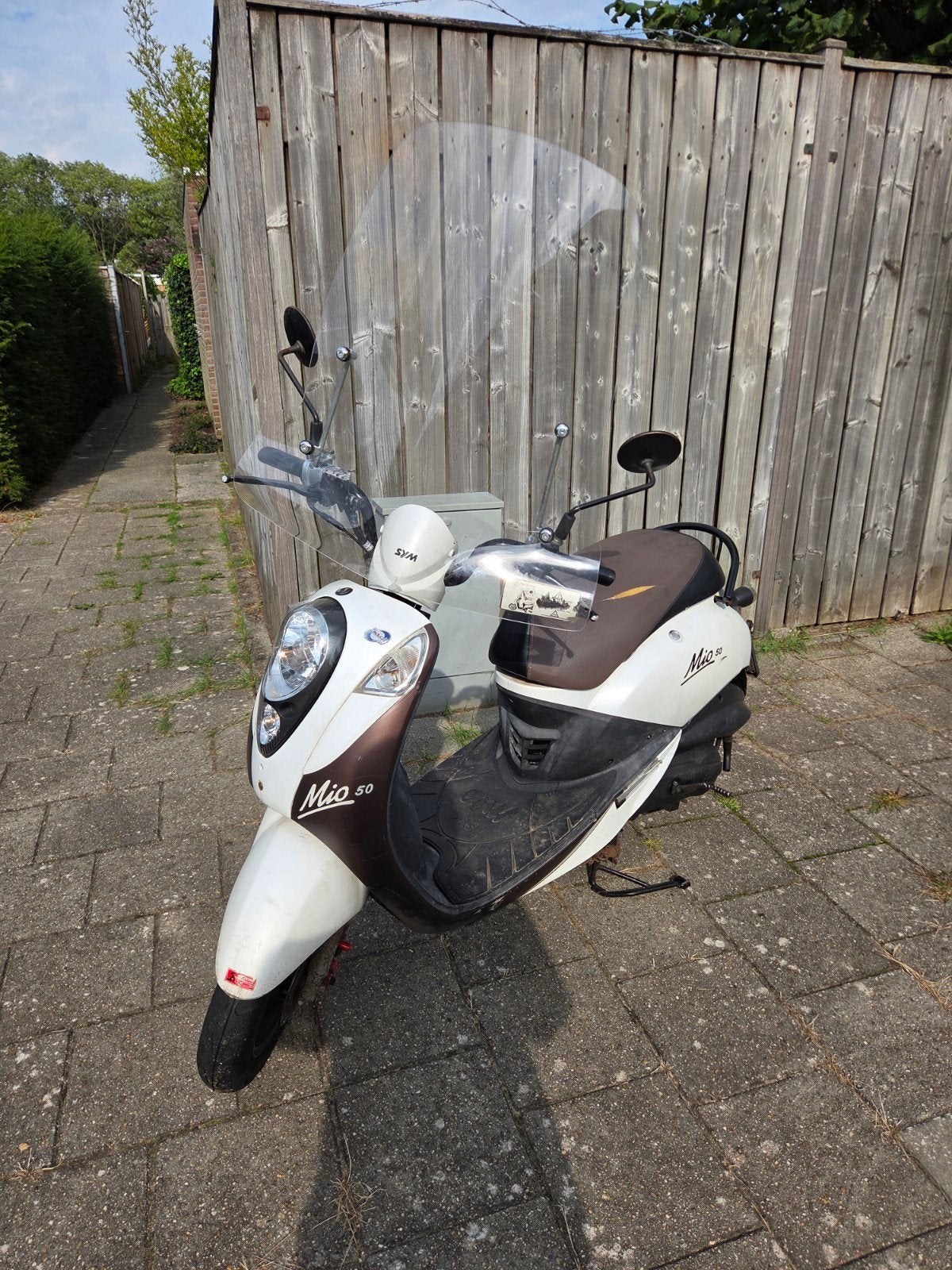 SYM Mio 50 scooter met windscherm en helm, Ophalen, Gebruikt, Benzine, SYM