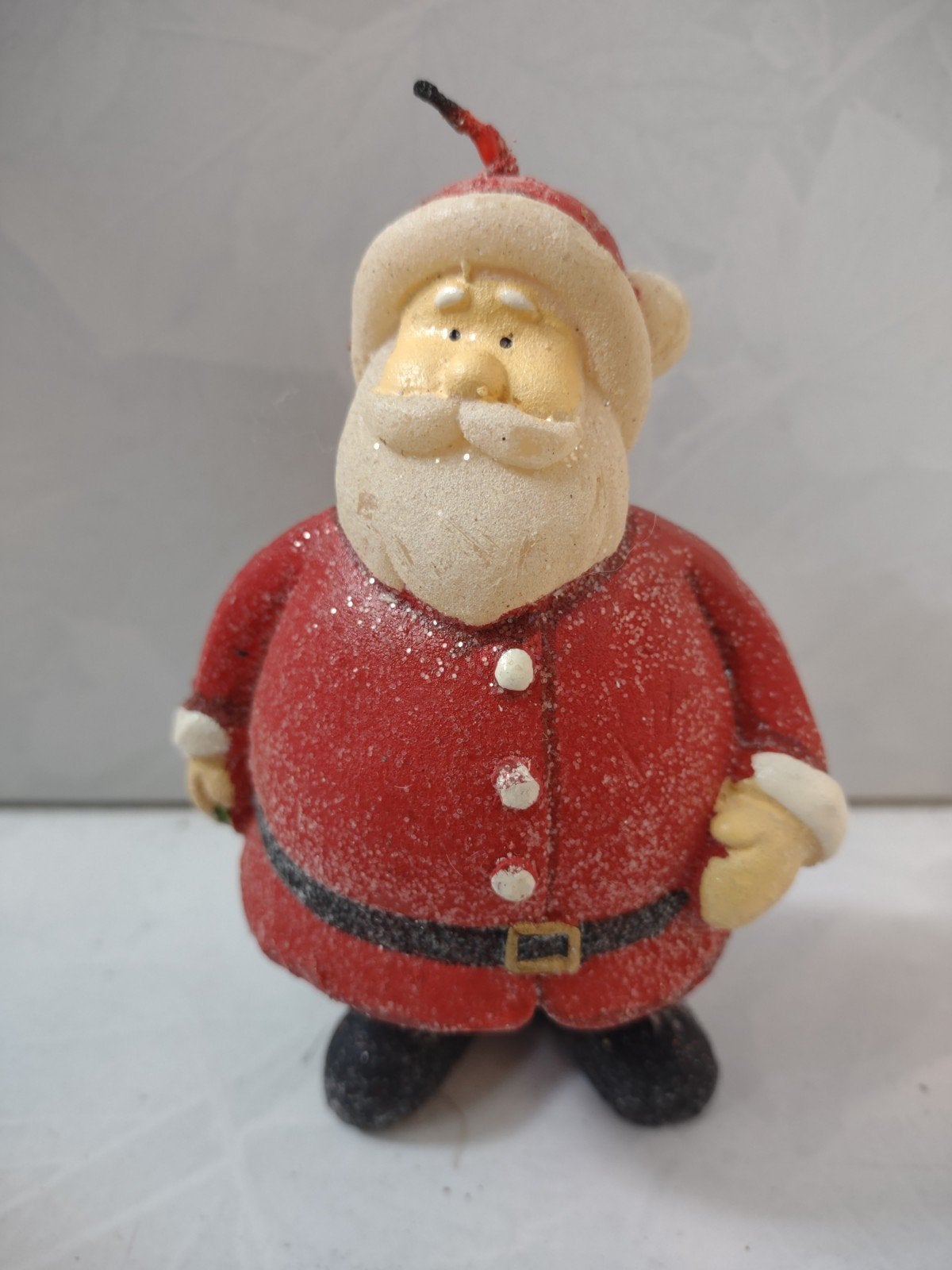 Kerstman kaars, Ophalen