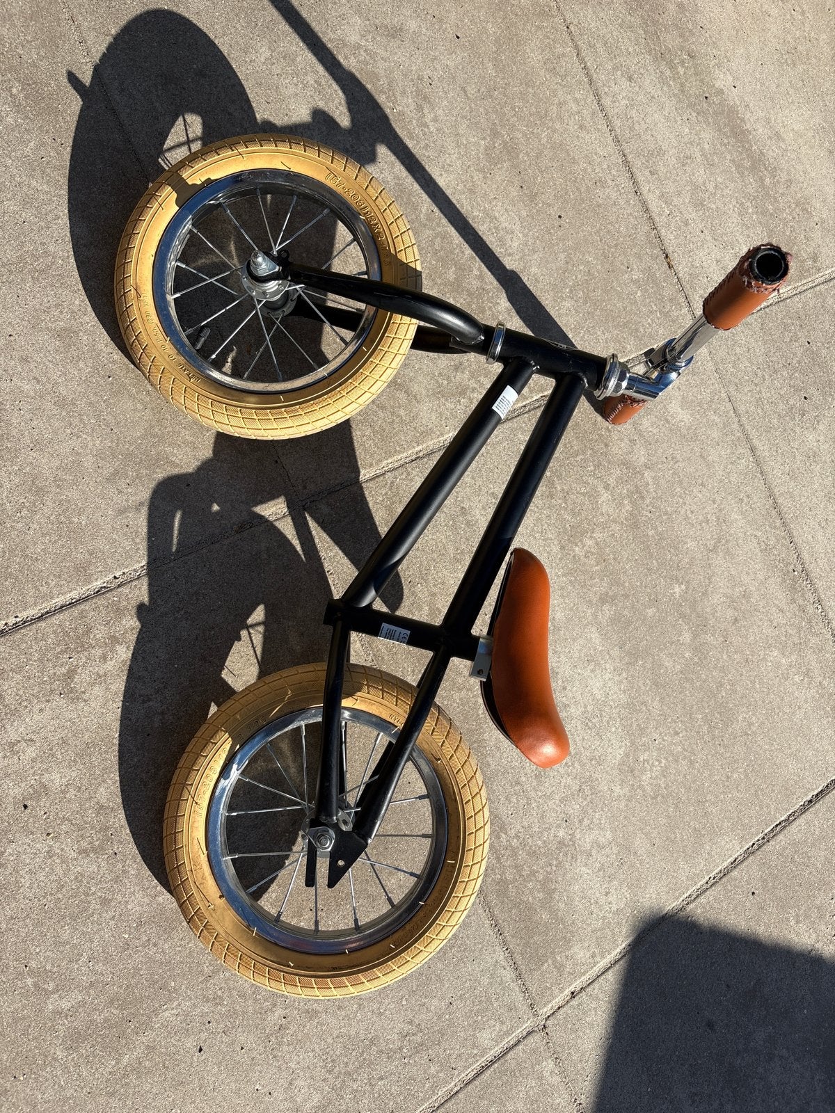 Stoere zwarte loopfiets met bruine accenten, Ophalen, Zo goed als nieuw, Loopfiets