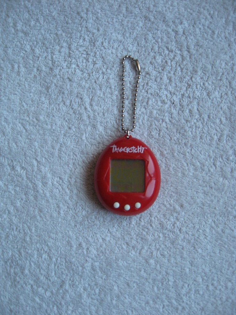 Bandai 1997 - rode Tamagotchi (zie omschrijving), Verzamelen, Ophalen of Verzenden, Zo goed als nieuw