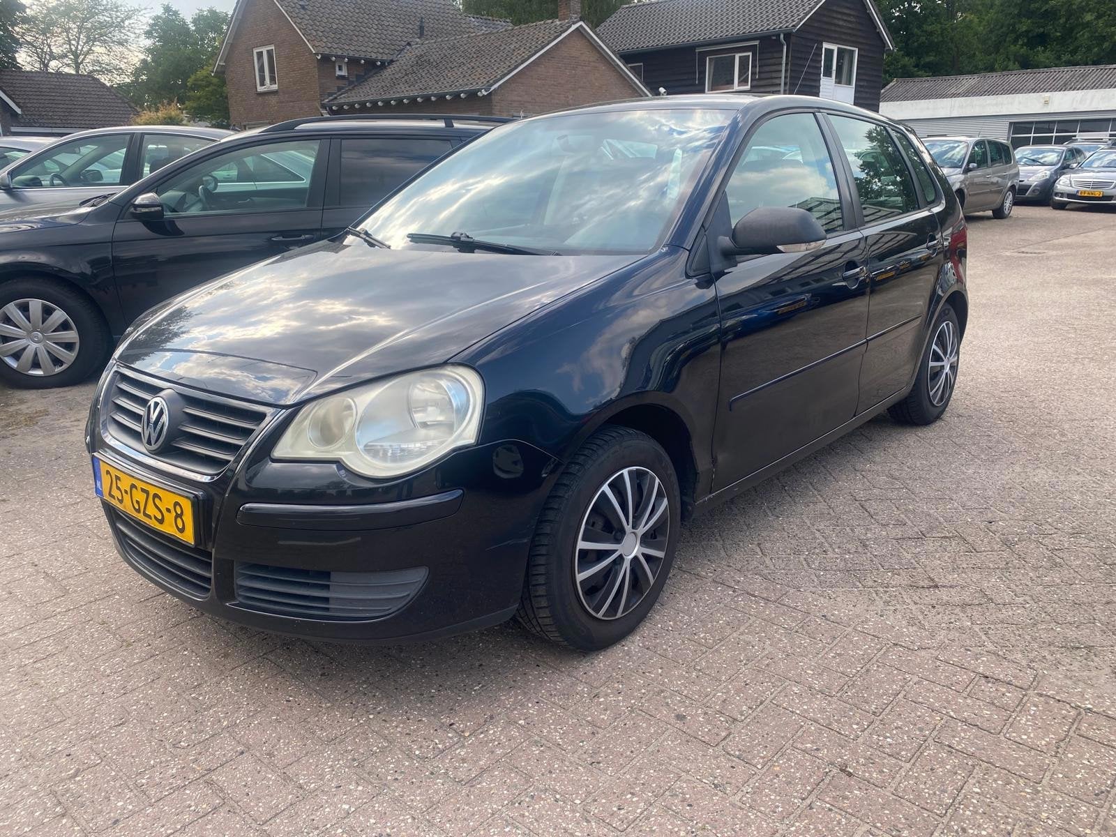 Volkswagen Polo 1.4-16V Optive, Auto's, Voorwielaandrijving, Stof, Zwart, 4 cilinders