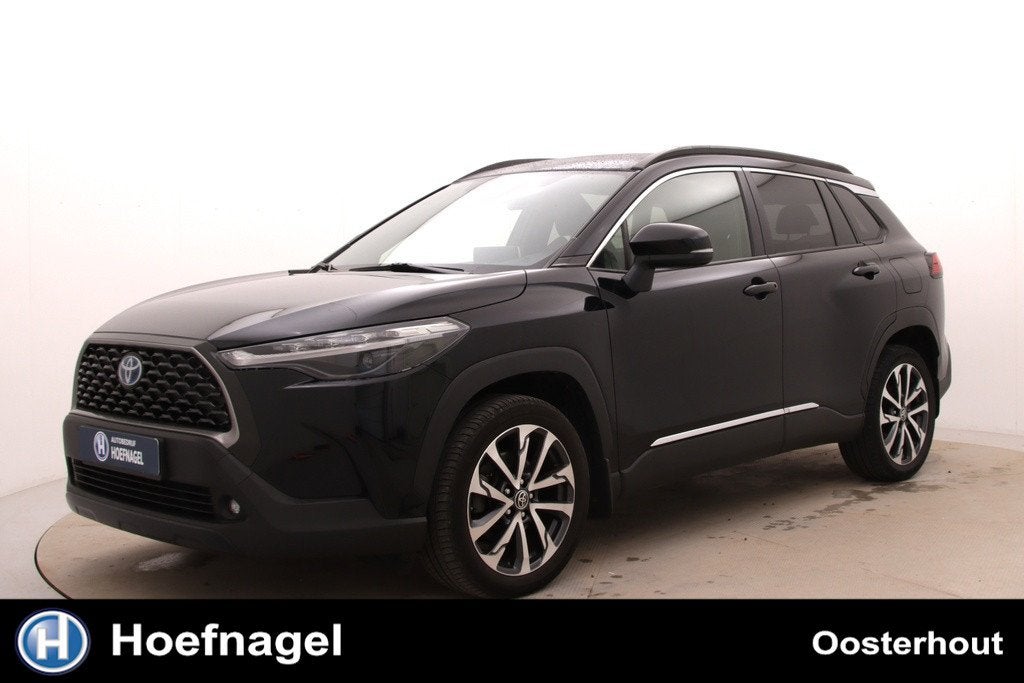 Toyota Corolla Cross 2.0 High Power Hybrid Active | Automaat, Auto's, Stof, Gebruikt, 4 cilinders, Zwart