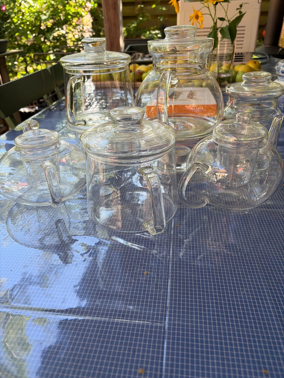 7 Douwe Egberts glazen theepotten met 2 theelichten, Overige merken, Ophalen, Theepot/fluitketel, Glas