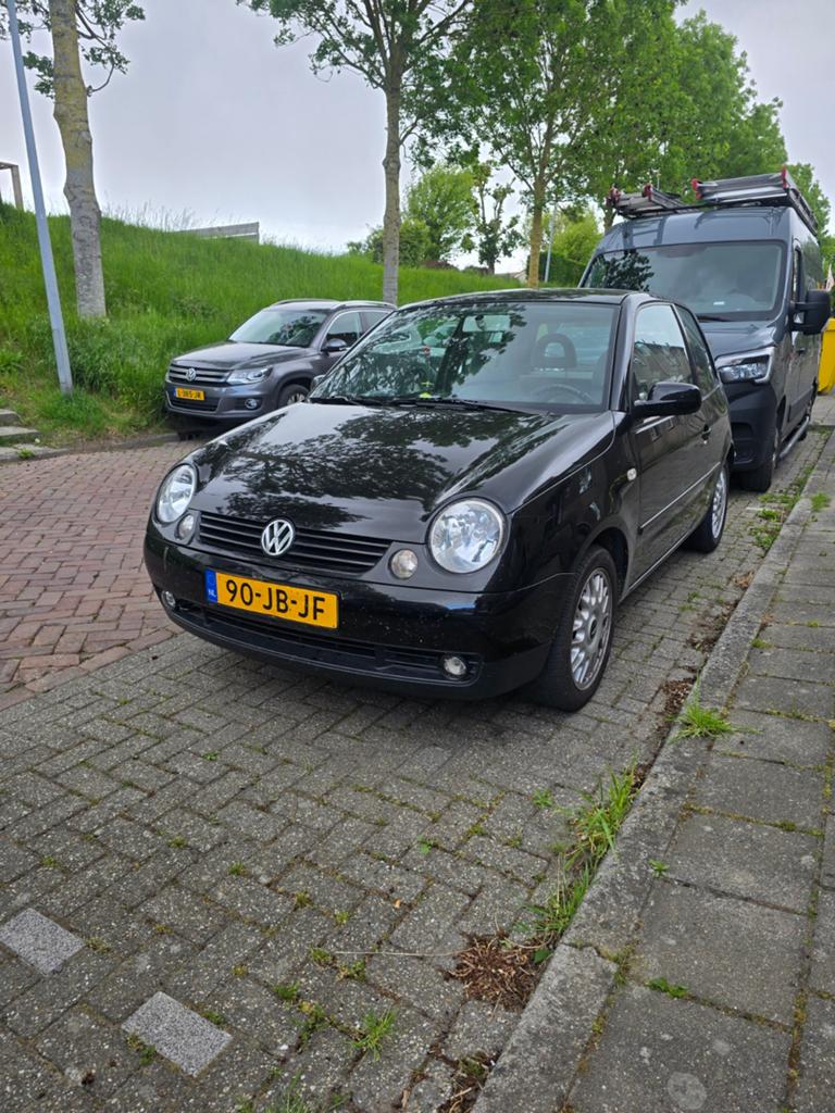 Volkswagen Lupo 1.4 44KW 2002 Zwart, Auto's, Voorwielaandrijving, 450 kg, 31 €/maand, 4 cilinders