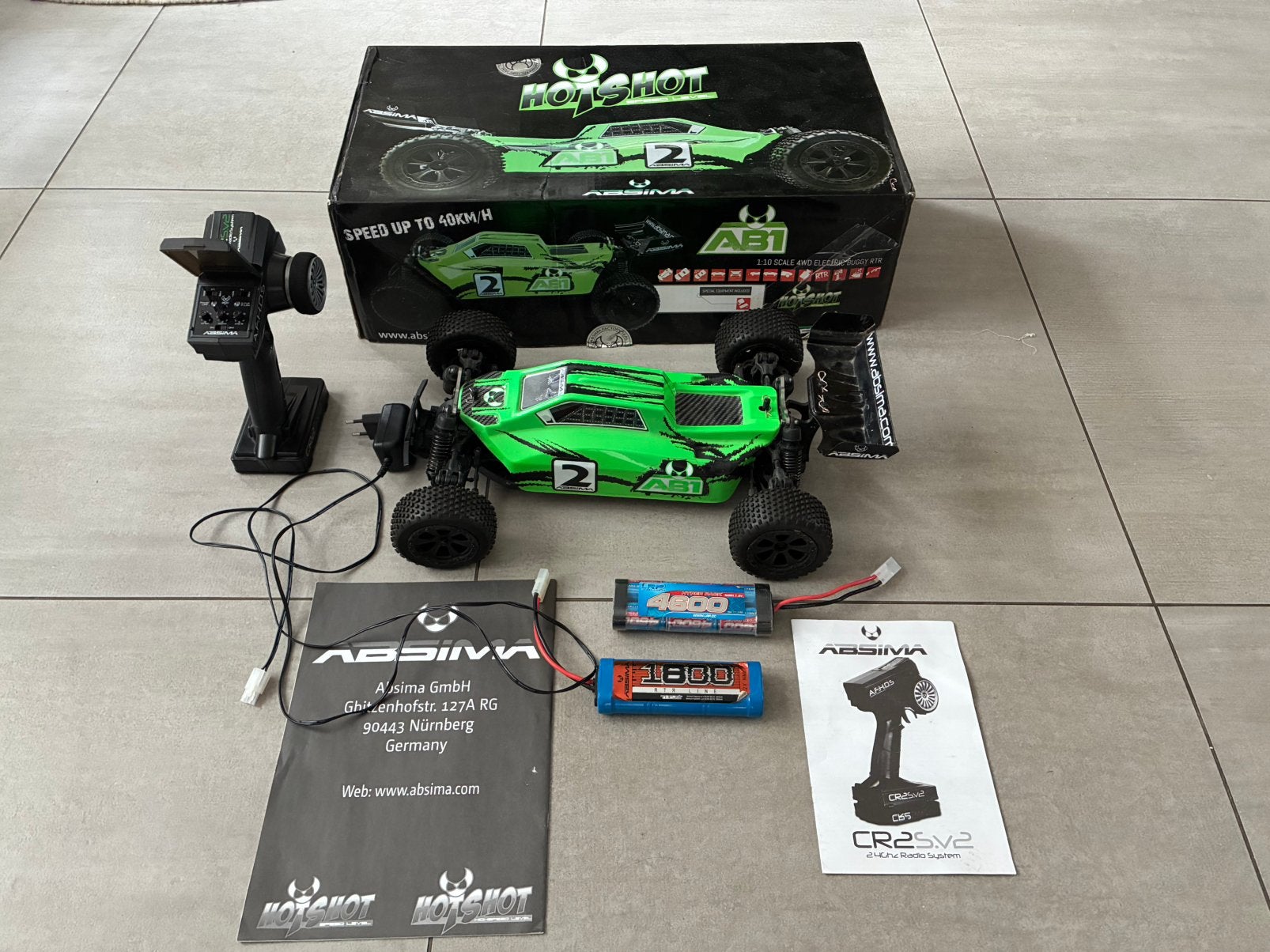 Zeer complete absima AB1 buggy + doos, lader en dubbele accu, Ophalen of Verzenden, Zo goed als nieuw, Overige schalen, Auto offroad