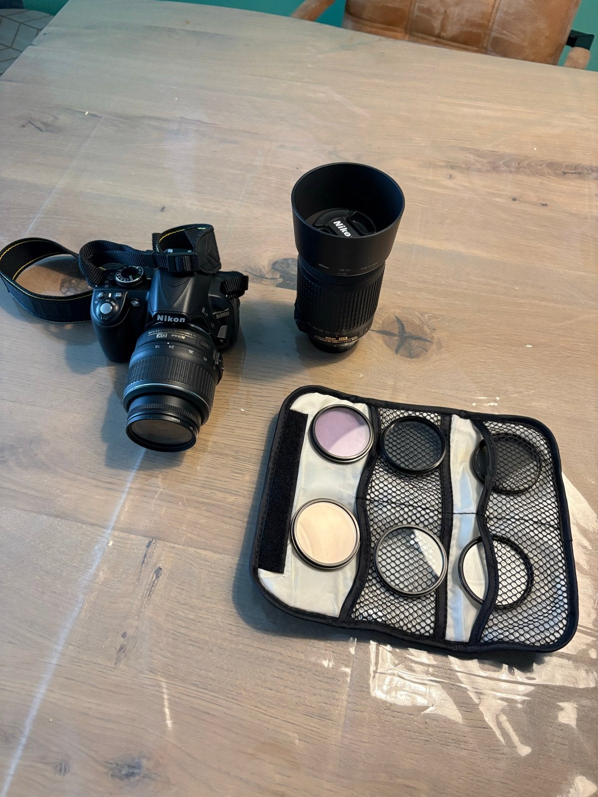 Nikon D3100 met twee lenzen, filters en tas, Gebruikt, Spiegelreflex, Accu, Nikon
