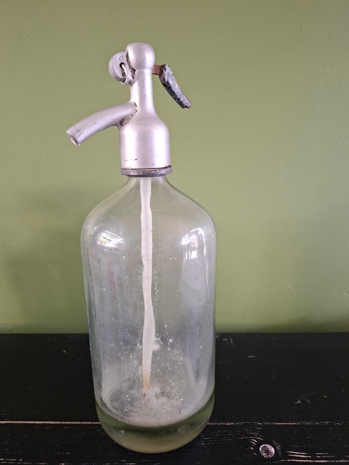 brocante spuitfles, Ophalen