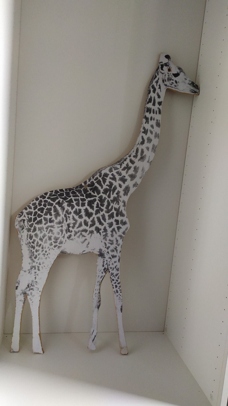 Houten giraffe neer te zetten of op te hangen, Ophalen