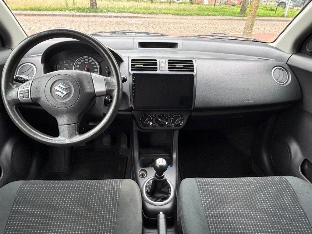 Suzuki Swift 1.5 Exclusive Rijklaarprijs !, Auto's, Suzuki, Zwart, 4 cilinders, 400 kg, Swift