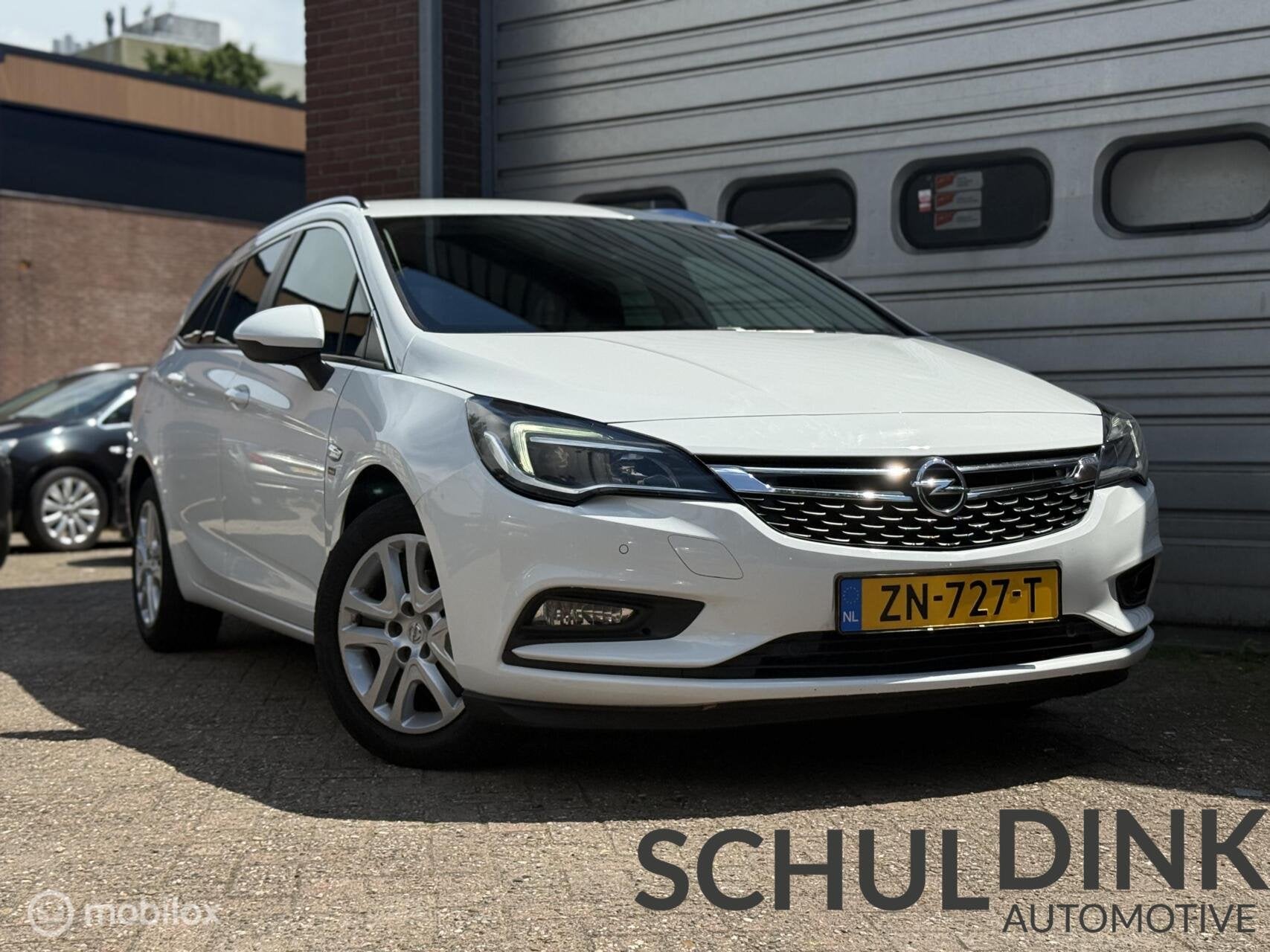 Opel Astra Sports Tourer 1.0 Turbo 120 Jaar TREKHAAK|CAMERA, Voorwielaandrijving, Gebruikt, Euro 6, 1178 kg
