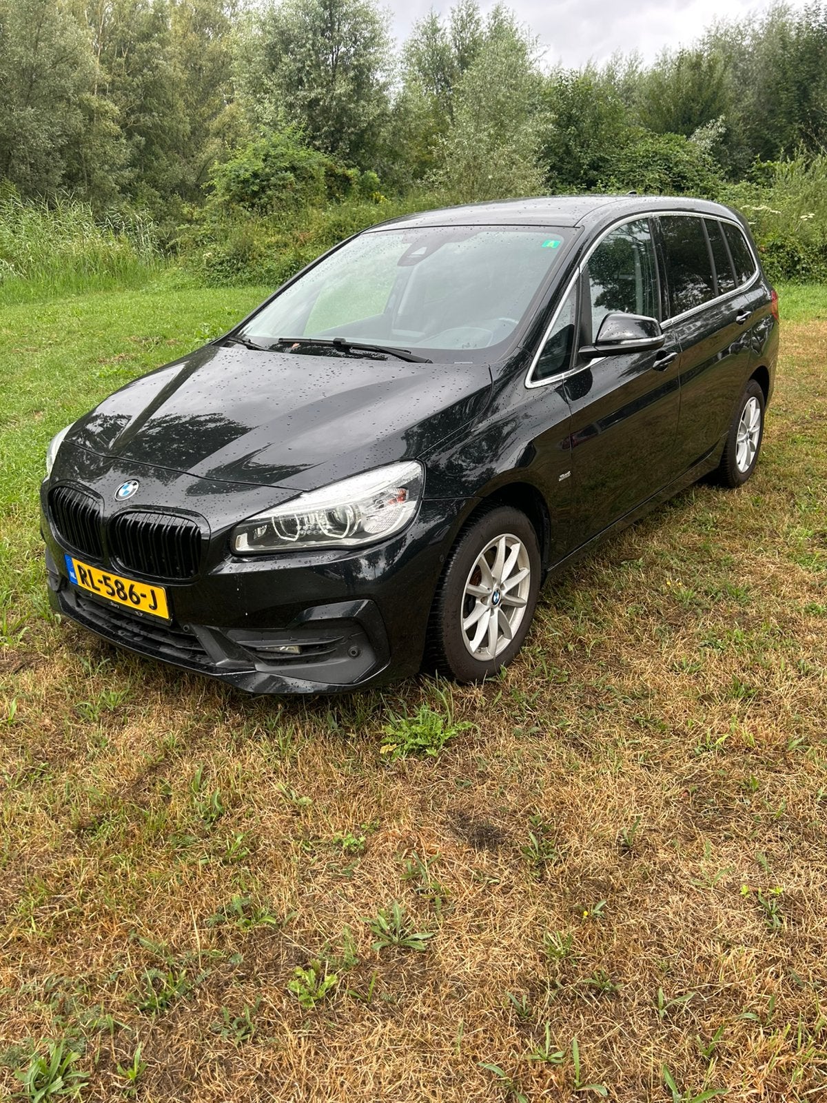 BMW 2-Serie Gran Tourer 218i 136pk Aut 5p. 2018 Zwart, Auto's, BMW, 2-Serie Gran Tourer, Zwart, Origineel Nederlands, 19 km/l