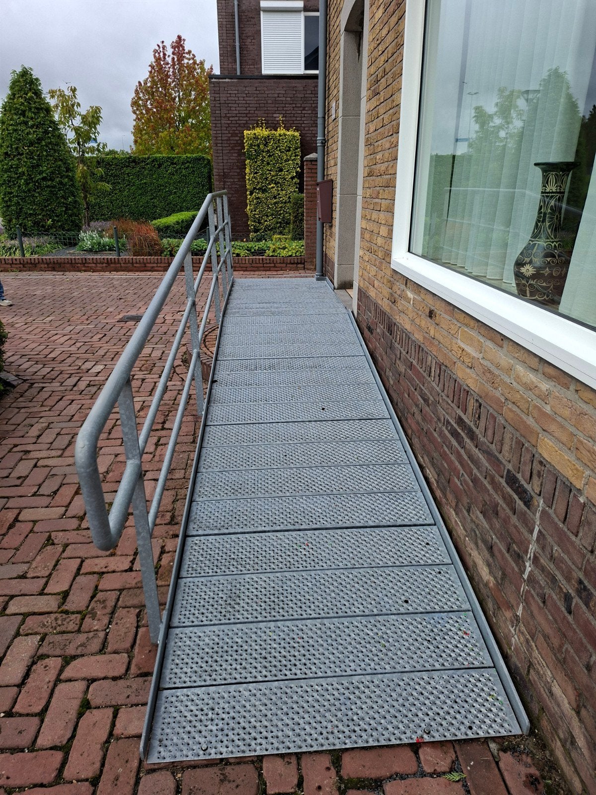 opgang mindervalide toegang rolstoel rollator, Ophalen