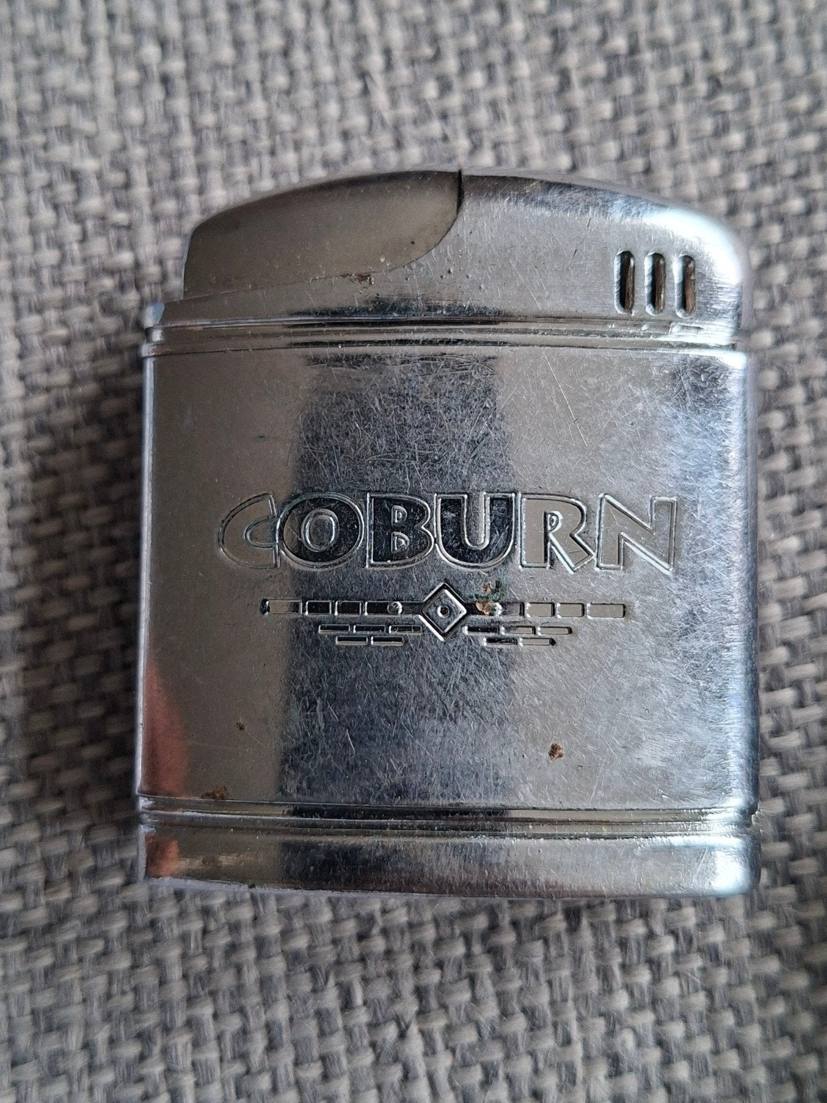 Vintage Coburn Benzineaansteker met Indiaan Hoofd + Tasje, Ophalen of Verzenden, Gebruikt, Aansteker