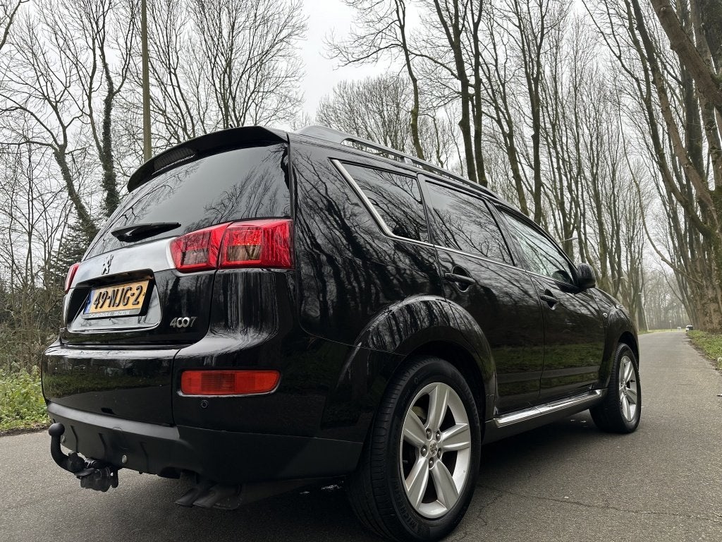 Peugeot 4007 2.2 HDiF Platinum | 7p | trekhaak | airco |, Auto's, Peugeot, Euro 5, Gebruikt, Zwart, 7 stoelen