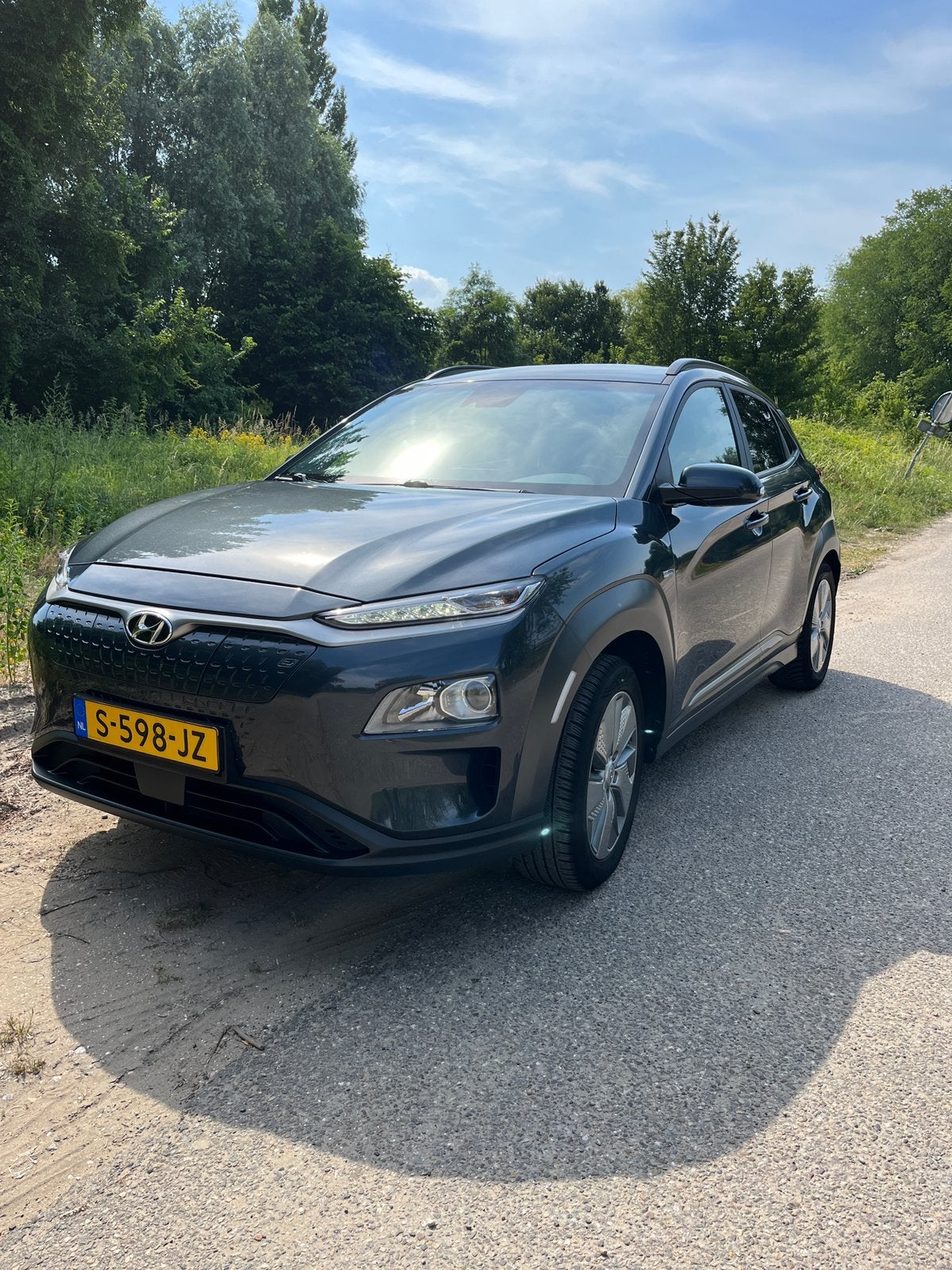 Hyundai Kona EV 136pk 2WD Aut. 2020 Grijs, Auto's, Hyundai, 14 kWh, 47 min, Elektrisch, Particulier