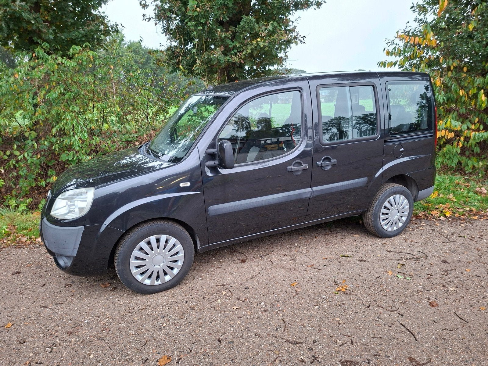 Fiat Doblo 1.4 57KW 2008 Zwart. 7 pers.uitvoering. APK NIEUW, Auto's, Voorwielaandrijving, Stof, 7 stoelen, Zwart