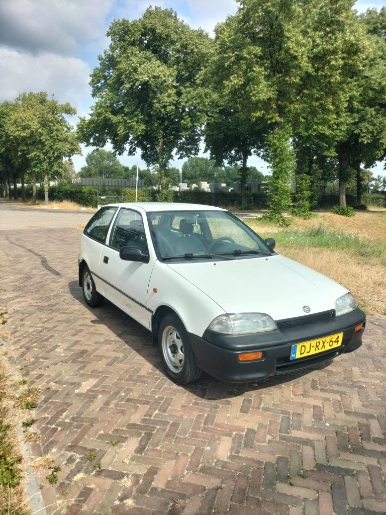 Suzuki Swift 1.3 GL U9 1992 Wit, Voorwielaandrijving, Stof, 4 cilinders, Origineel Nederlands