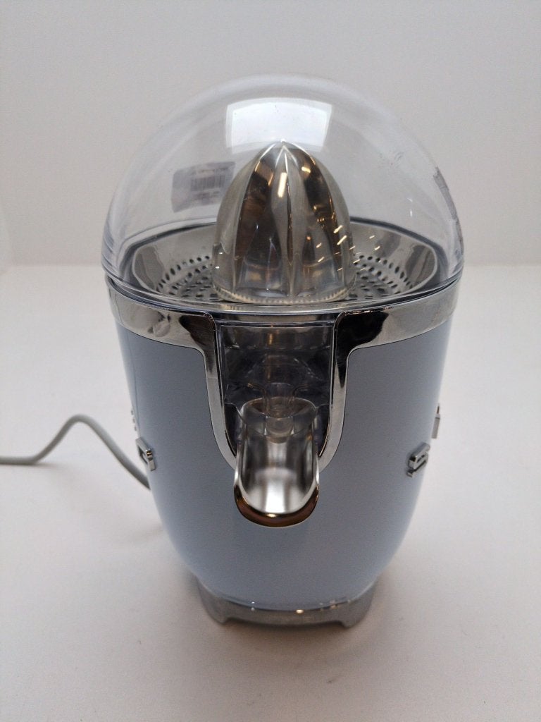 SMEG citruspers CJF11PBEU pastelblauw - retourdeal, Witgoed en Apparatuur, Citruspers, Nieuw, Bruggestraat 18, Elektrisch