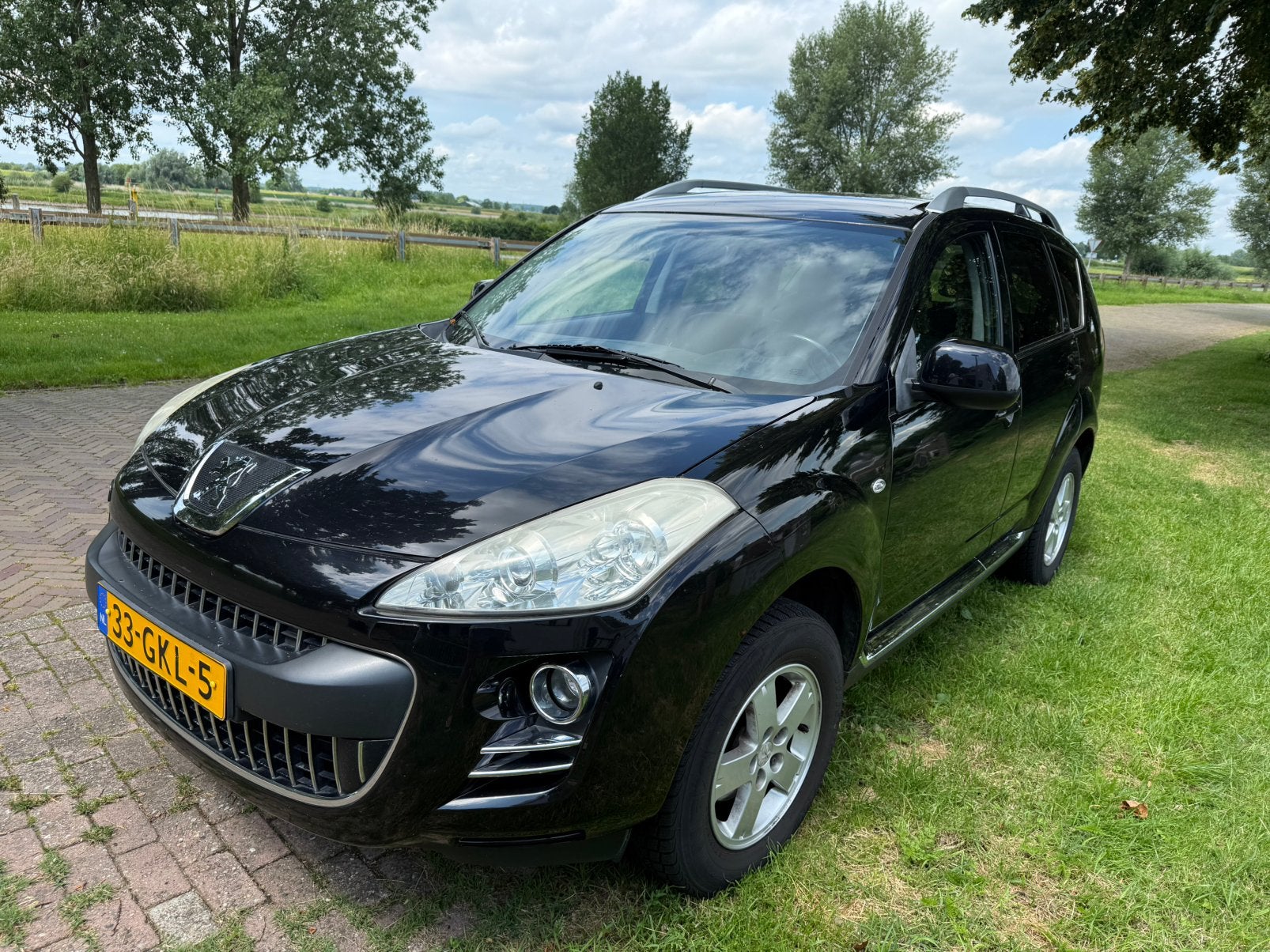 Peugeot 4007 2.4 16V 4WD 7P 2008 Zwart, Auto's, 4 cilinders, 7 stoelen, Zwart, Handgeschakeld