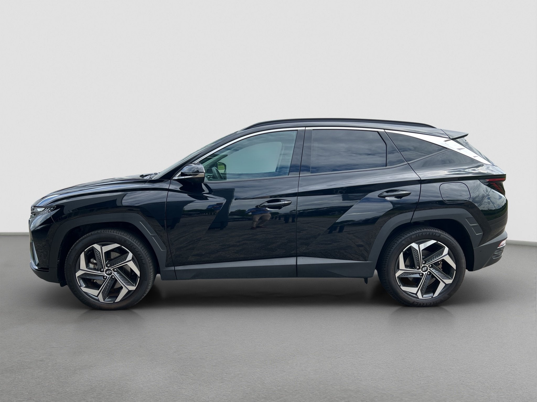Hyundai TUCSON 1.6 T-GDI 265pk PHEV Premium 4WD, Auto's, Gebruikt, 4 cilinders, Zwart, Bedrijf