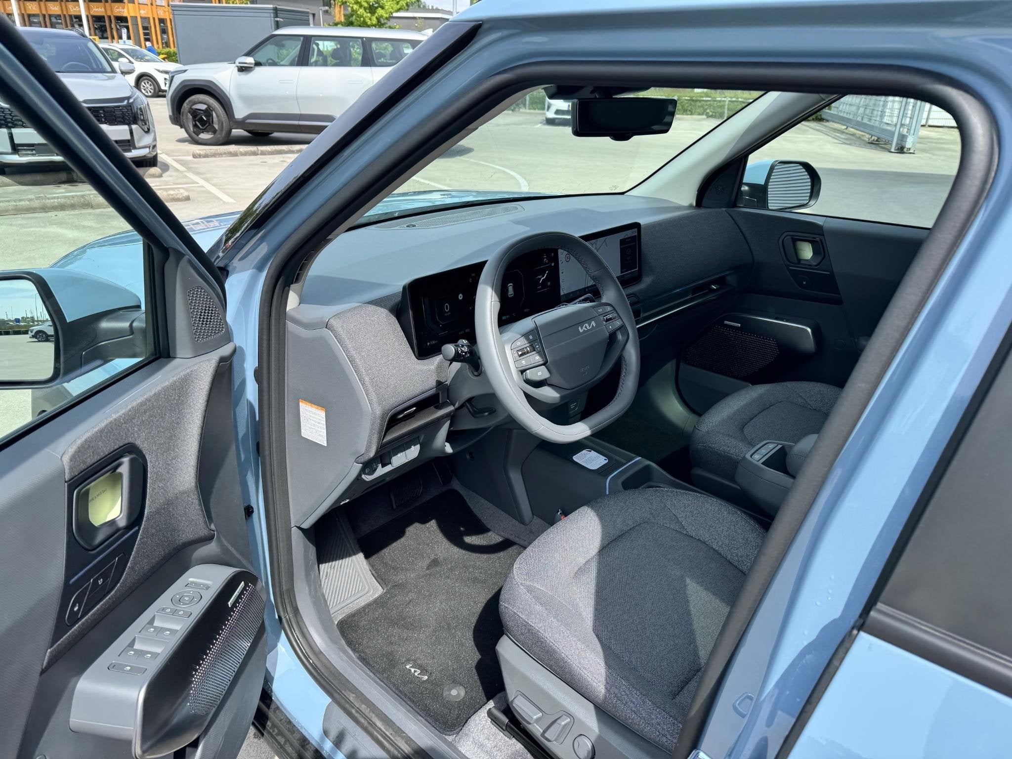 Kia EV2 Plus Advanced 42.2 kWh Demo Edition | Beschikbaar vo, Auto's, Stof, Gebruikt, Blauw, Te koop