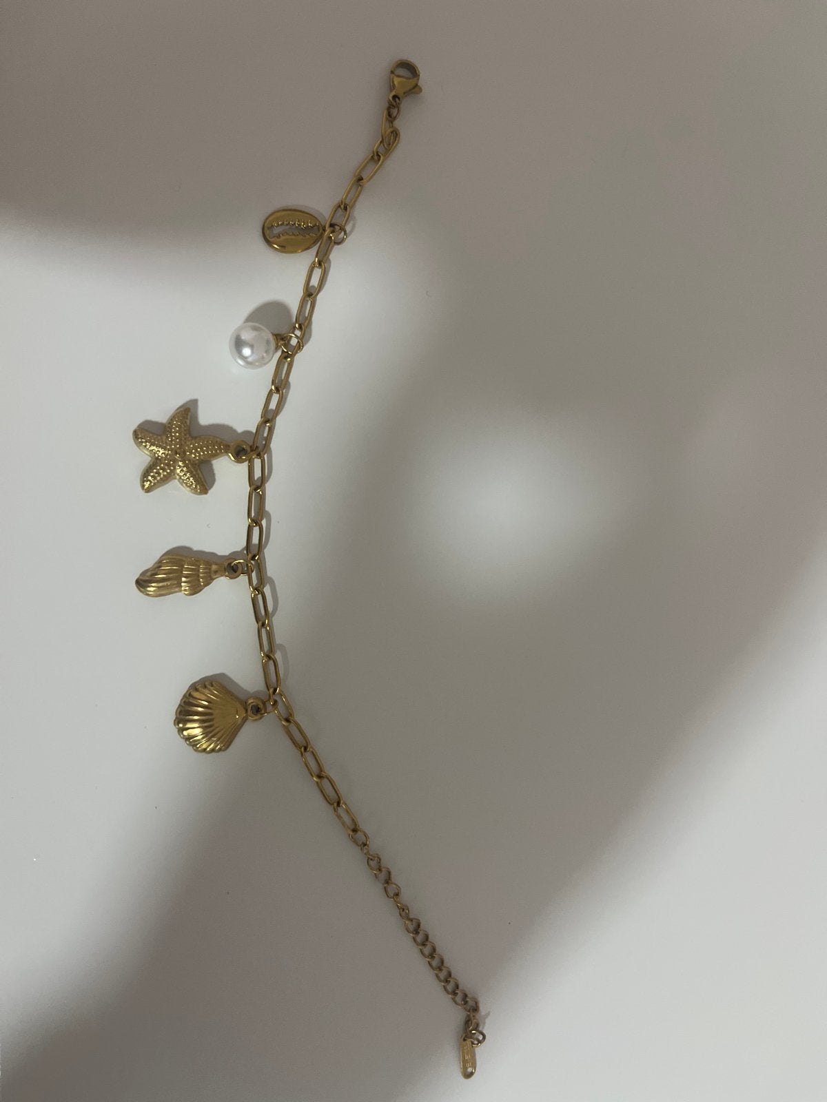 Schelpjes armband, Staal, Ophalen of Verzenden, Zo goed als nieuw, Met bedels of kralen