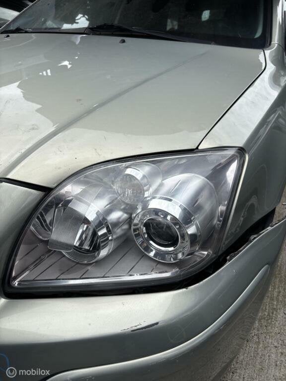 Koplamp links Toyota Avensis Wagon II ('03-'09), Auto-onderdelen, Verlichting, Gebruikt, Toyota, Ophalen of Verzenden, Toyota