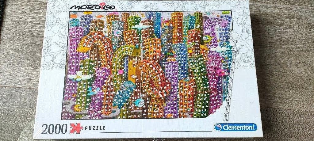 Puzzel Mordillo Clementoni --NIEUW-- 2000 stukjes, Ophalen of Verzenden, Meer dan 1500 stukjes, Nieuw, Legpuzzel