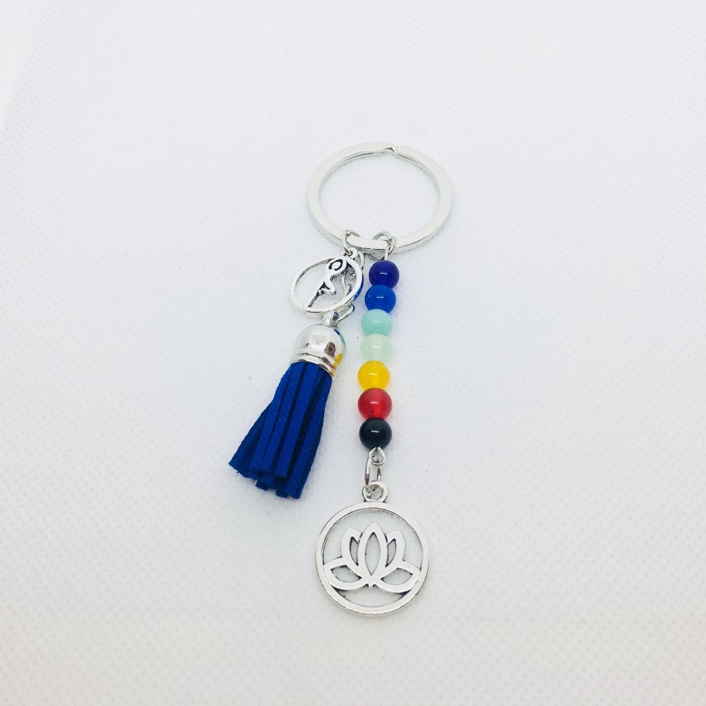 Lotus sleutelhanger met blauw suède kwastje, Ophalen of Verzenden, Nieuw