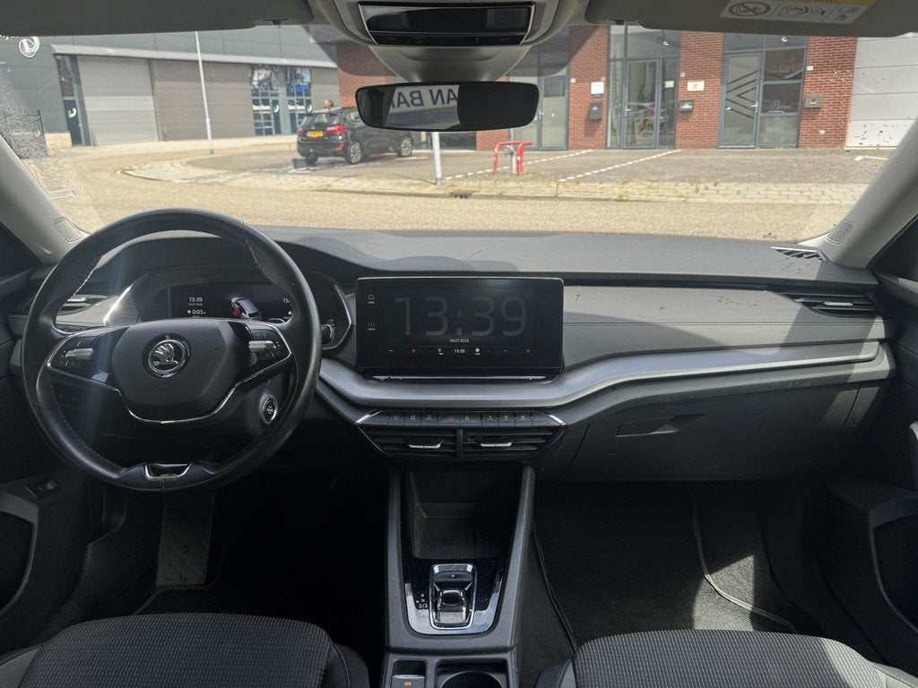 Skoda Octavia Combi 1.0 e-TSI Business Edition ✅ Automaat, Auto's, 12 maanden, Stof, Gebruikt, Hybride Elektrisch/Benzine