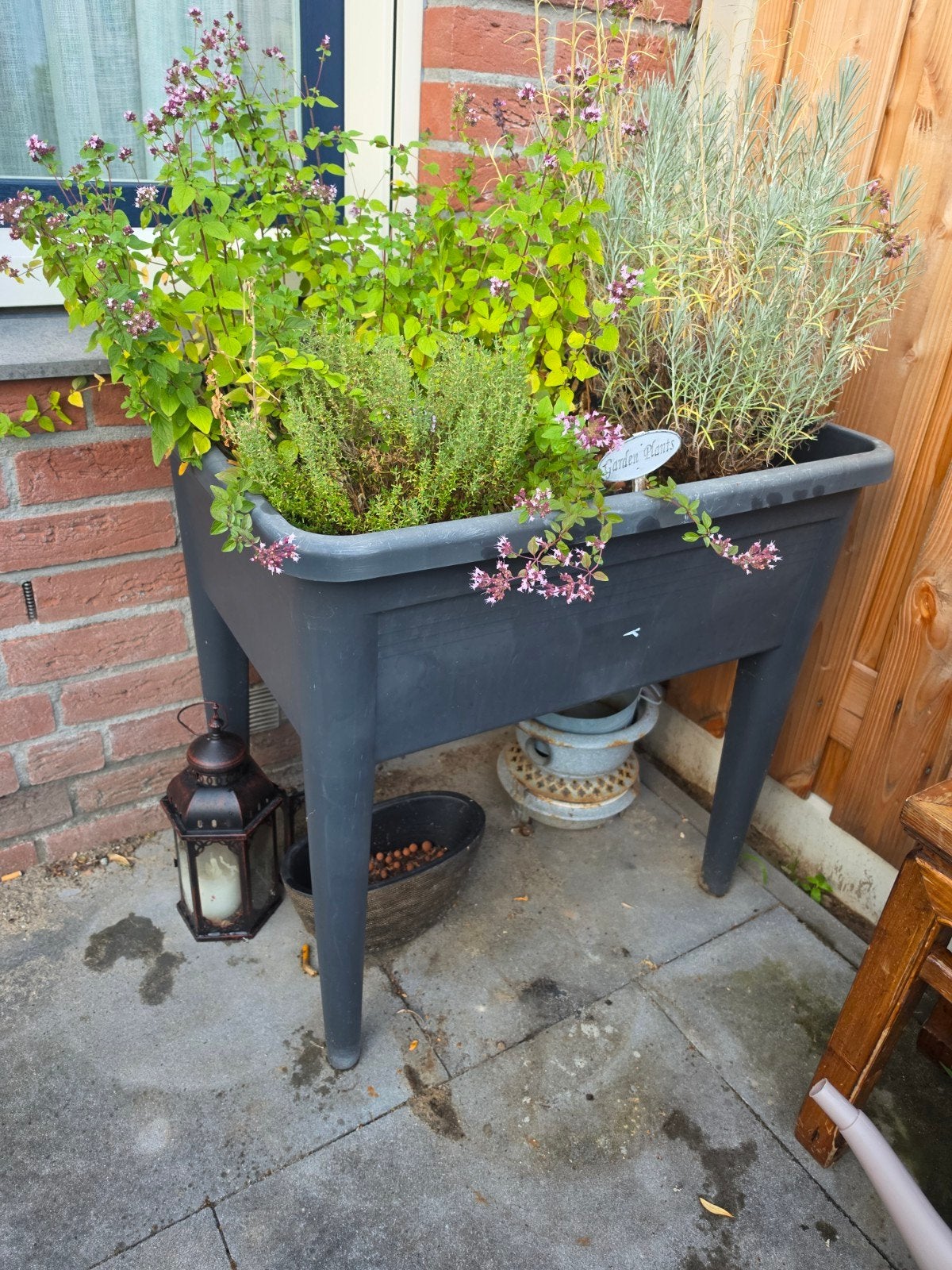 Zwarte plantenbak op poten voor kruiden of bloemen, Kunststof, Gebruikt, Ophalen of Verzenden, 60 tot 100 cm