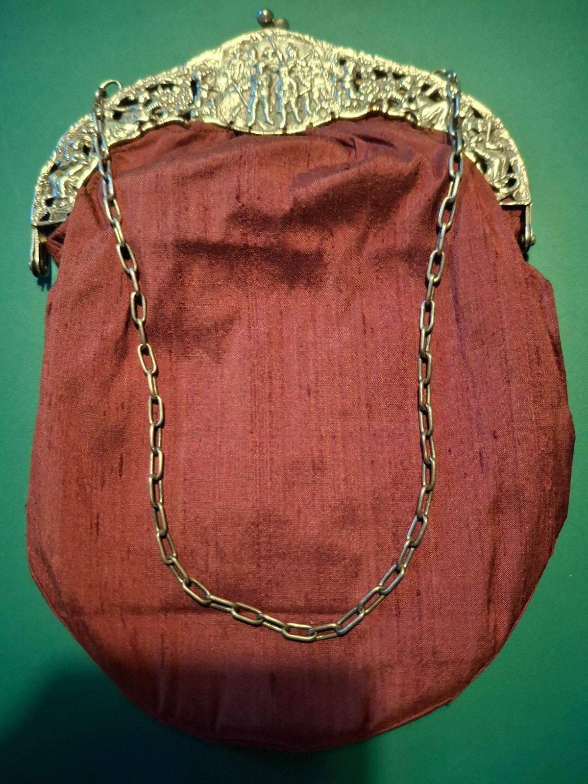 Zilveren  tasbeugel, Ophalen