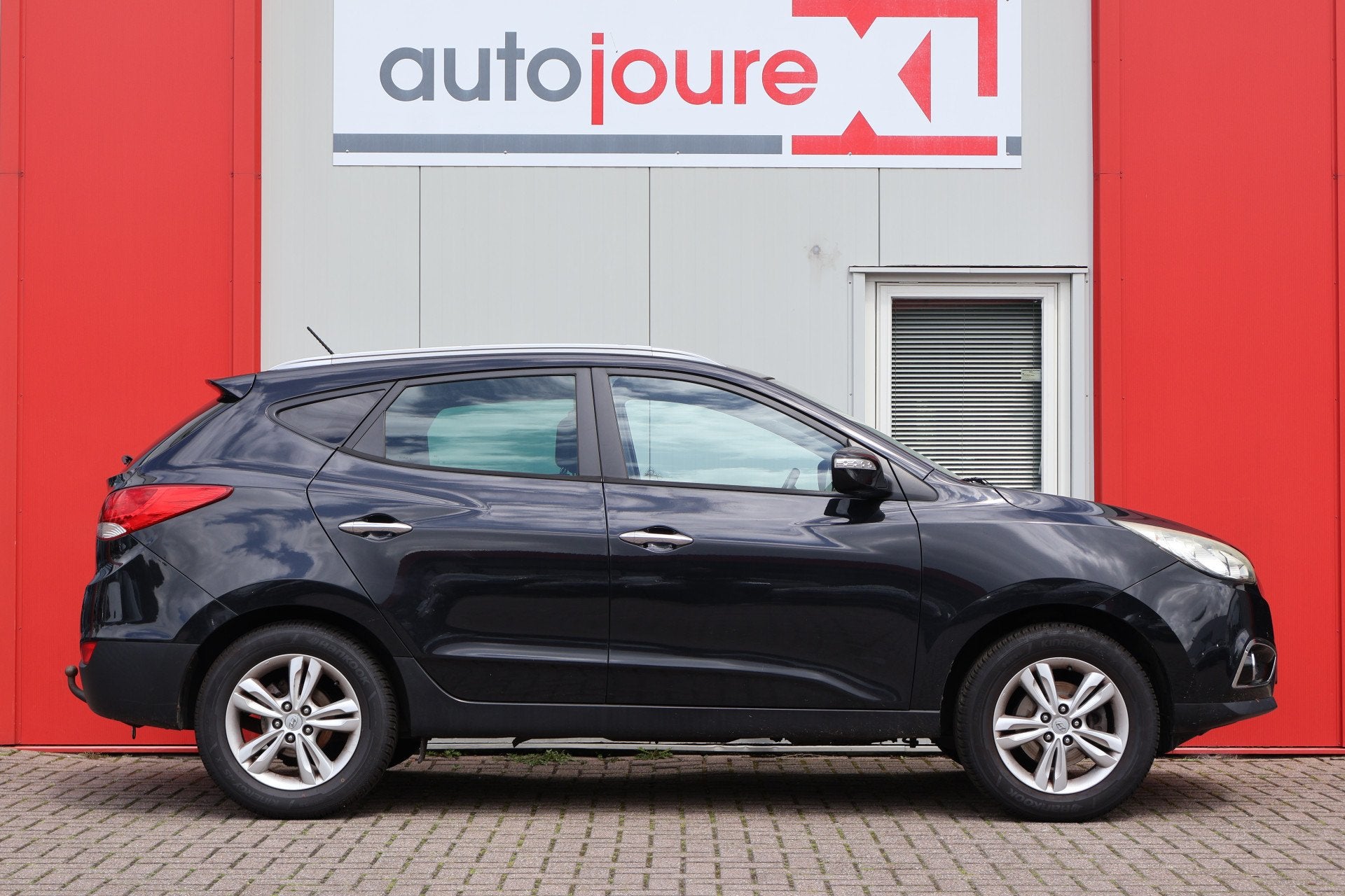 Hyundai ix35 2.0i Style (bj 2011), Auto's, Gebruikt, Zwart, 4 cilinders, Leder en Stof