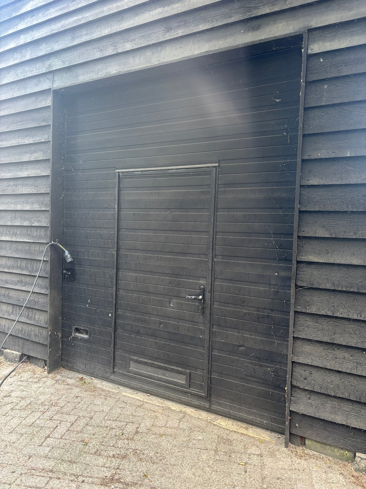 Gebruikte Garagedeur met Loopdeur - Zwart, Doe-het-zelf en Verbouw, Deuren en Horren, Ophalen, Gebruikt, Garagedeur, Metaal