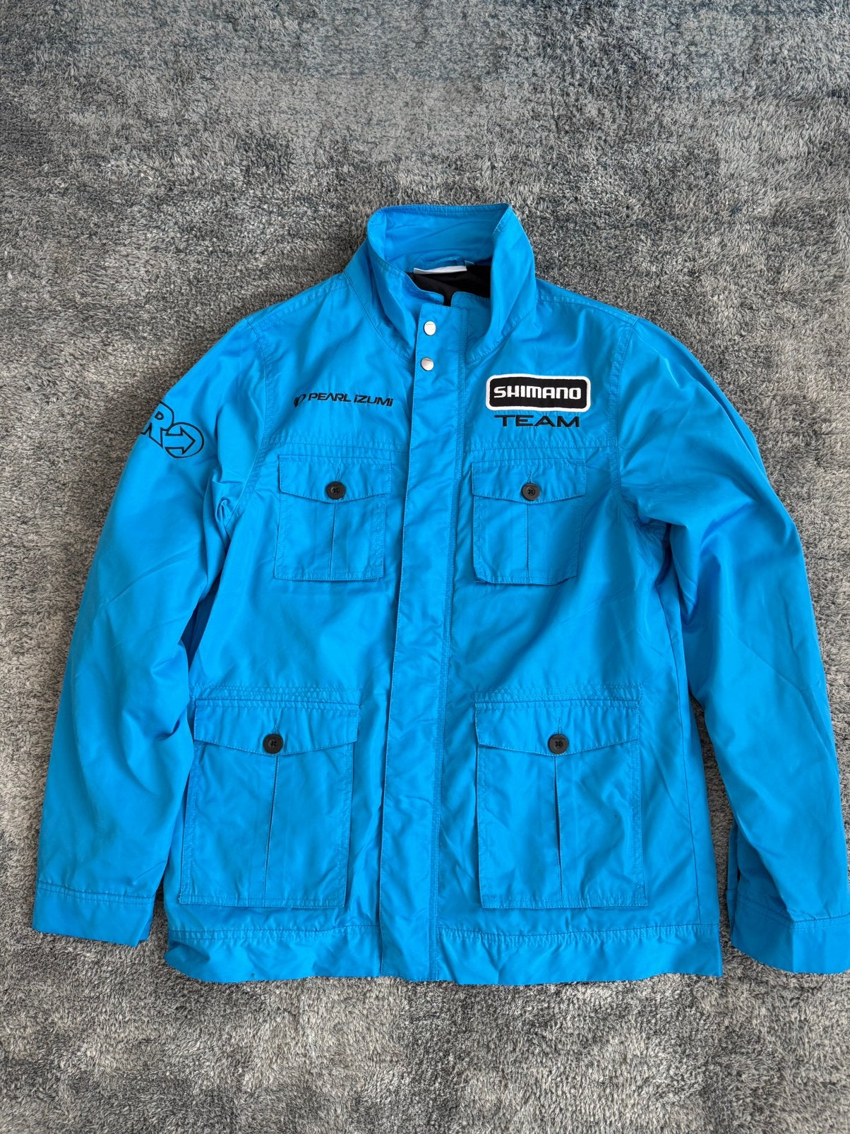 (Nieuw) Shimano Team x Pearl Izumi Paddock Jas - Maat L, Ophalen of Verzenden, Nieuw, Maat 52/54 (L), Blauw