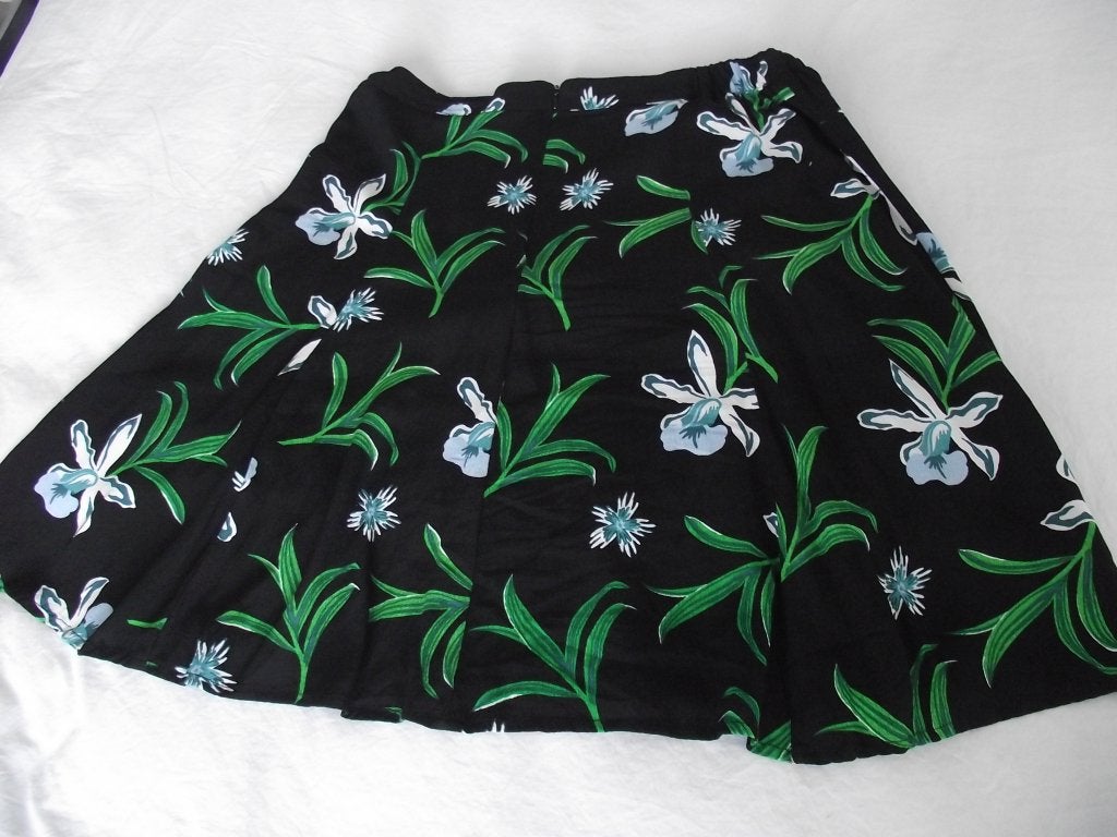 zwart tricot turquoise groen lelies bloemen rok Hema M 38-40, Maat 38/40 (M), Zwart, Ophalen of Verzenden, Knielengte