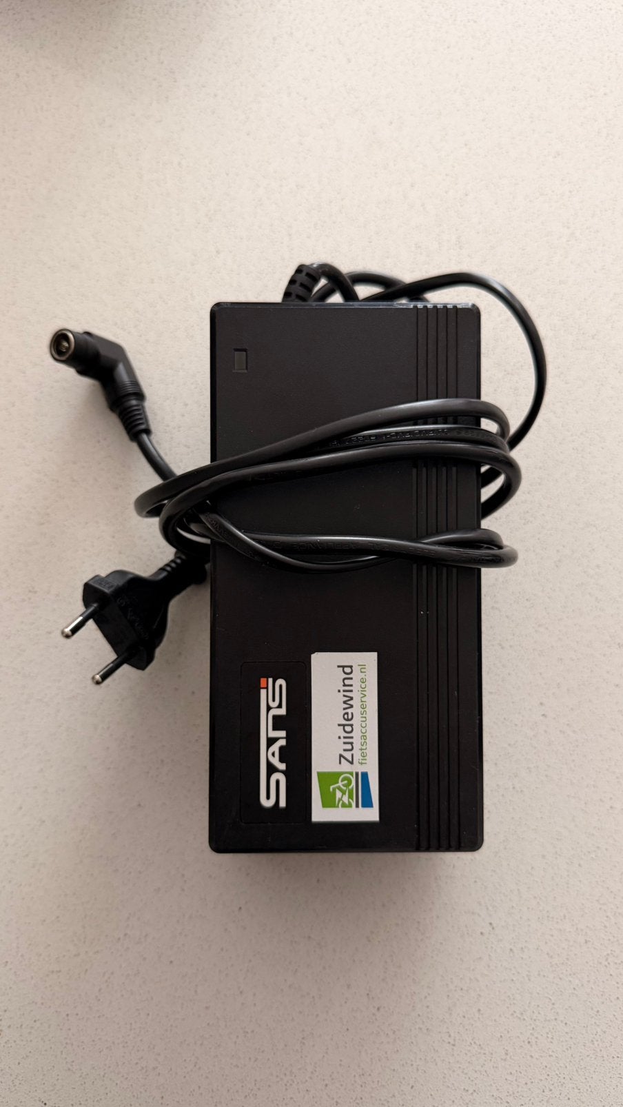Originele SANS E-Bike Lader 42V 3A SSLC126V42X, Fietsen en Brommers, Fietsaccessoires | Overige Fietsaccessoires, Ophalen of Verzenden