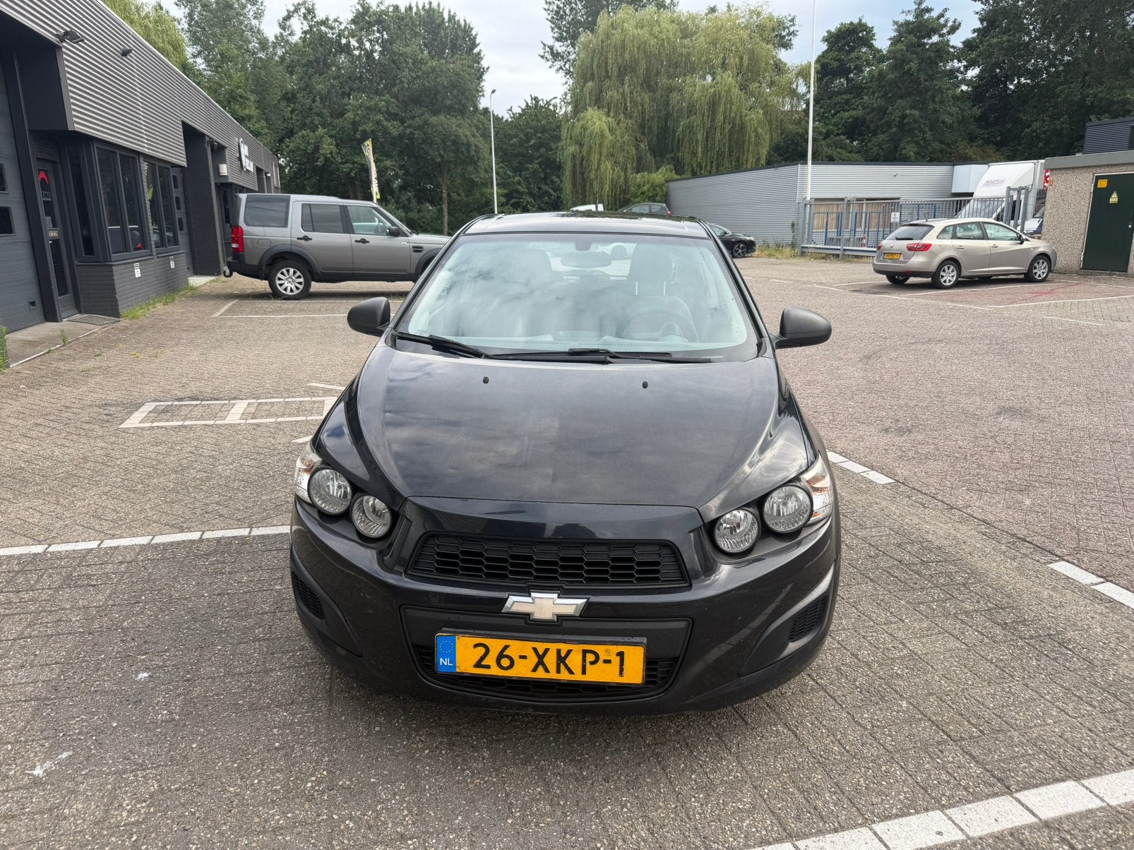 Chevrolet Aveo 1.2 5-DEURS 2012 Zwart Nw Apk Airco Cruise, Voorwielaandrijving, Euro 5, Stof, 40 €/maand